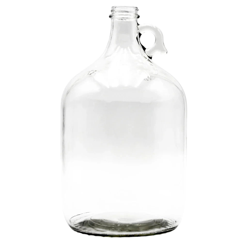 Clear 1 gallon glass jug on a white background
