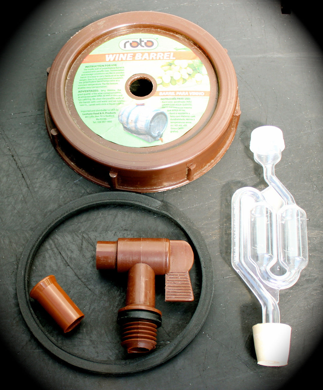 Set of Roto Barrel top cover with gasket, spigot and airlock kit on a black background