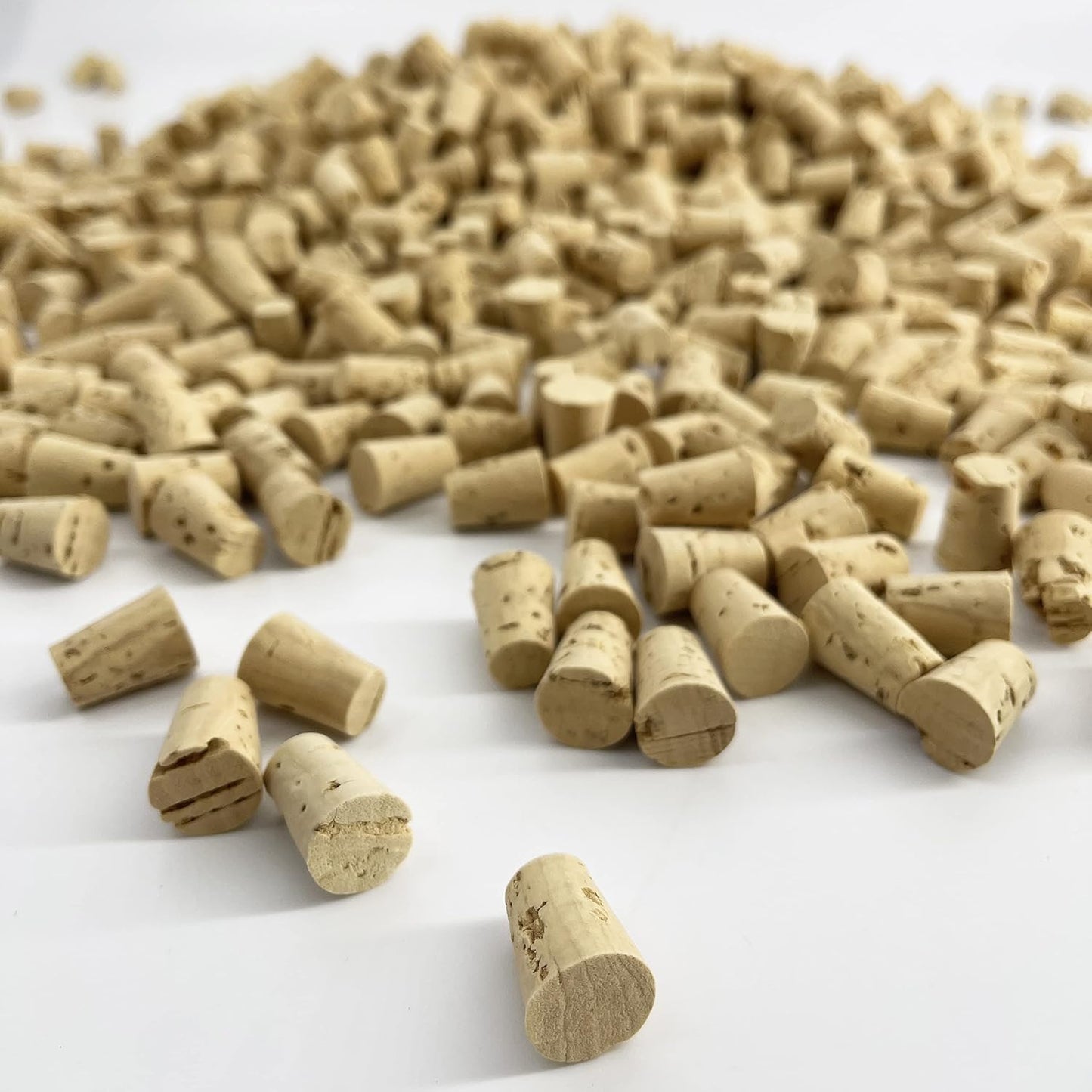 Collection of cork wine bottle stoppers on a white background