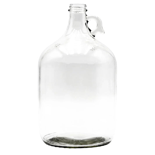 Clear 1 gallon glass jug on a white background