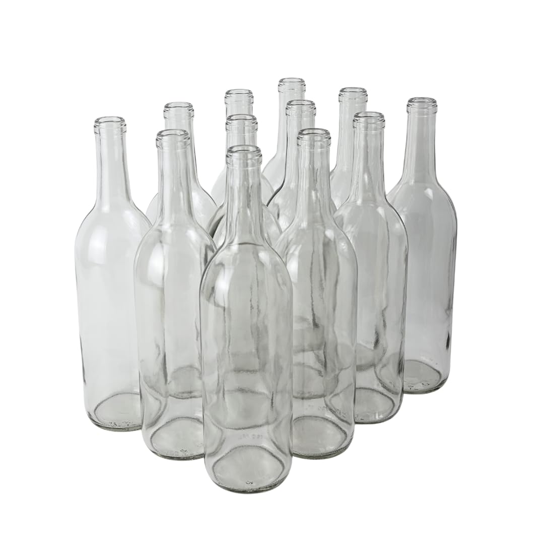 Set of clear glass bottles on a white background