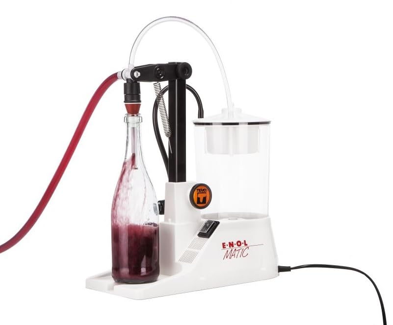White enolator with a bottle of red liquid on a white background